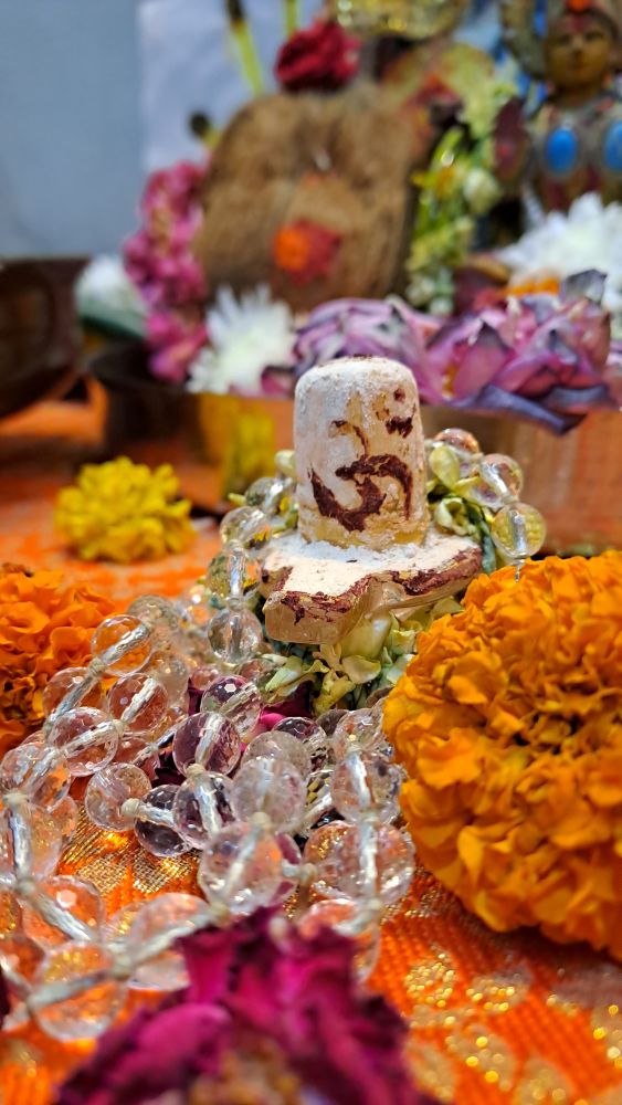 Sacred devotional offering with flowers and blessings
